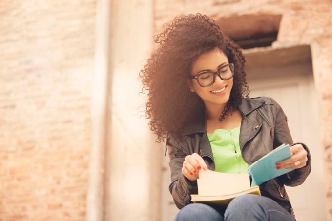 African american young woman with books