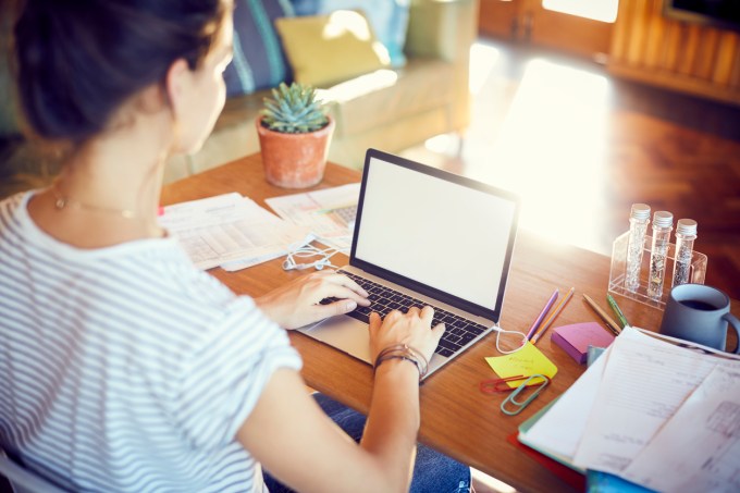 High angle view of woman is working at desk