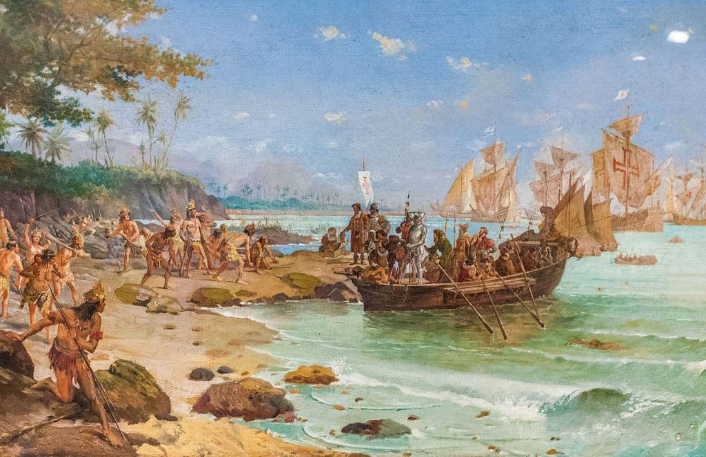 1200px-desembarque_de_pedro_acc81lvares_cabral_em_porto_seguro_em_1500_by_oscar_pereira_da_silva_1865e280931939 Óleo sobre tela de Oscar Pereira da Silva (1922).