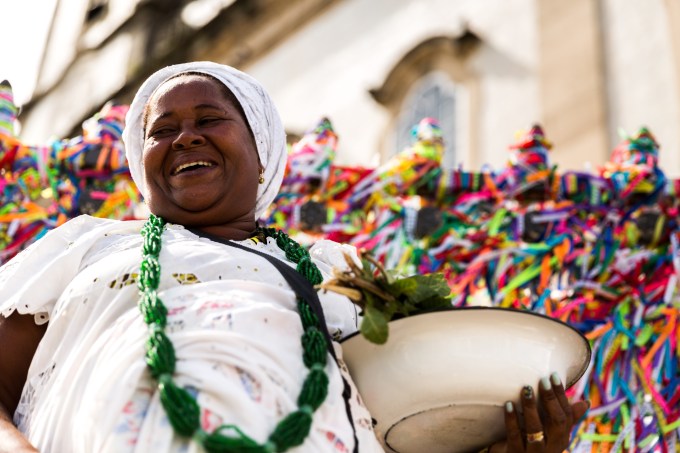 cultura bahia Candomble priestess wearing traditional clothes at Bonfim Church in Salvador, Bahia, Brazil