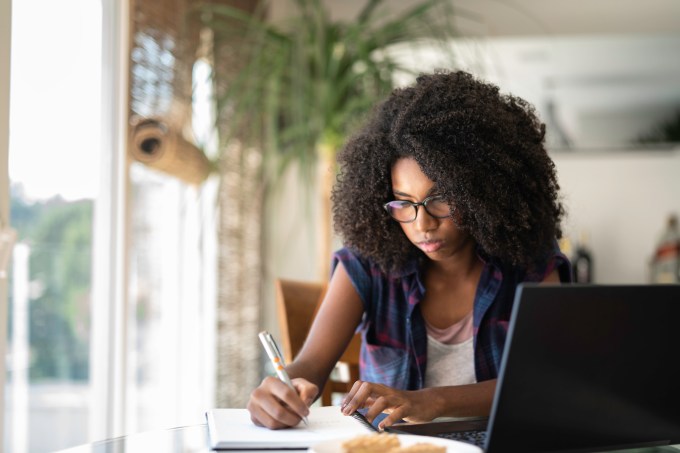 Teenager girl studying at home